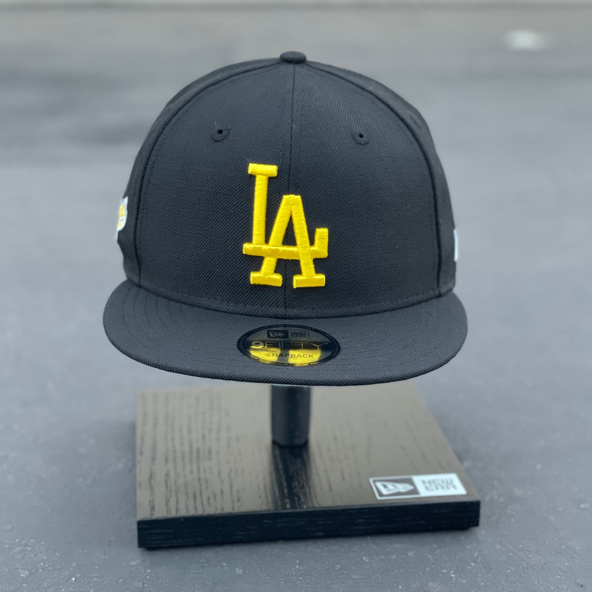 Buy the New Era black and gold cap from Los Angeles Lakers